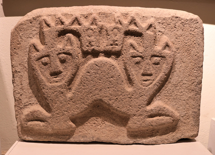 A stone slab found at Pashash is carved with an image of a two-headed mythical creature with feline and serpent characteristics. (Museo Arqueológico Zonal de Cabana/Mirko Brito)