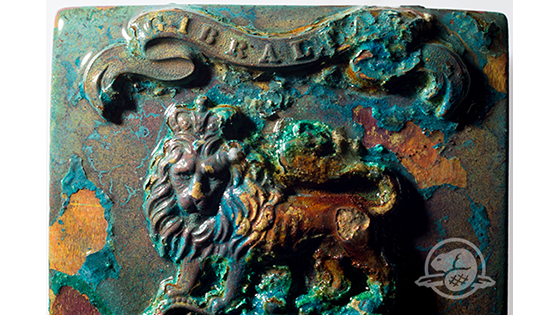 On the forward port side of Erebus, archaeologists found a number of artifacts, including a sword hilt and uniform buttons, that would have been issued to members of the British Royal Navy and Royal Marines. This shoulder belt plate, made of copper alloy and probably once gilded, had been issued to one of the 13 Royal Marines from the Woolwich Division that sailed on the expedition. (Parks Canada)