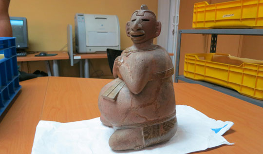 A two-piece incense burner—the upper torso lifts off—would have been used in ceremonies in which shamans divined messages from smoke.  It sits in storage at Guatemala’s National Museum of Archaeology and Ethnography. (Roger Atwood)