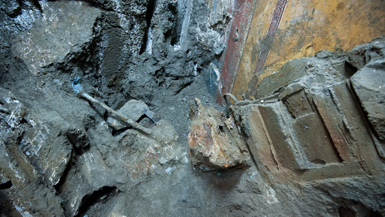Iron implements are embedded in volcanic ash close to the eastern wall of the triclinium. Archaeologists believe they are tools that were being used to restore the complex immediately before the eruption of Mt. Vesuvius.