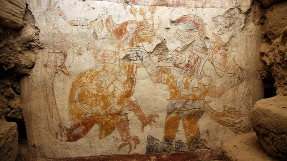This mythological scene known from iconography on ceramics depicts a battle between the Moche mythological hero Ai-Apaec (right) and a Strombus monster (left) whose shell is adorned with a two-headed serpent. It had never been seen before in a mural or in polychrome until 2010 when it was uncovered.  