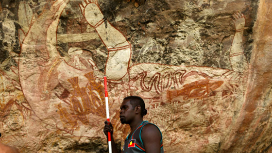 Patrick Lamilami, youngest son of Ronald, the traditional owner of the land where both Djulirri and Malarrak reside, now sometimes works as a guide to the area’s rock art sites. Here he stands before the central panel at Malarrak, which is dominated by a large painting of a crocodile. There is a similar depiction at Djulirri. The crocodiles may have been painted as markers of culture in a time of great change—when outsiders first arrived. 