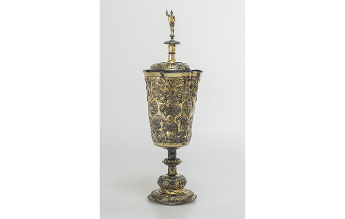 A highly decorative sixteenth-century German gilded silver cup topped with a figure of Mars, the Roman god of war, was heavily corroded and broken into three parts and partially flattened when it was recovered from the wreck. It has since been restored to its original form.