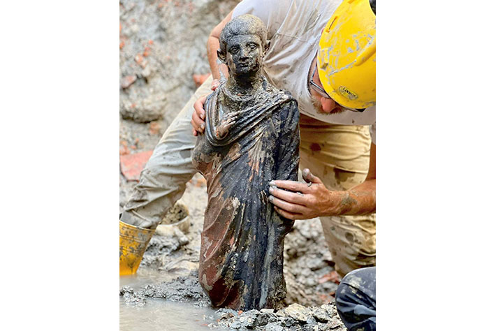 A bronze statue of a young boy excavated in San Casciano dei Bagni (Italy Soprintendenza ABAP per le province di Siena, Grosseto e Arezzo and Comune di San Casciano dei Bagni, Courtesy Jacopo Tabolli) 