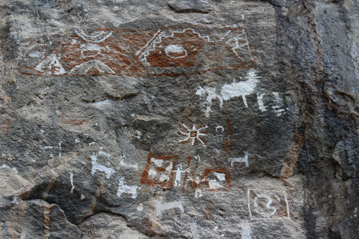 Rock art from the Andean site of Rocotuyoc in Peru dates to around A.D. 1000, and shows humans interacting with domesticated camelids, as well as abstract symbols. (Courtesy Victor Ponte)