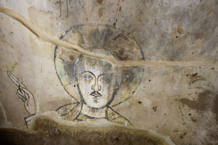 A painting of Jesus Christ thought to date to the thirteenth century was discovered in a small room below a sixteenth-century house in Old Dongola, once the capital of the medieval Kingdom of Makuria (ca. A.D. 400–1400). (Courtesy Adrian Chlebowski/PCMA UW)