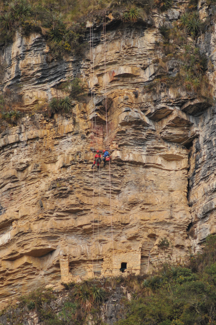 Archaeologists J. Marla Toyne (left) and Frankie St. Amand descend to a tomb built on a natural ledge at Le Petaca. 