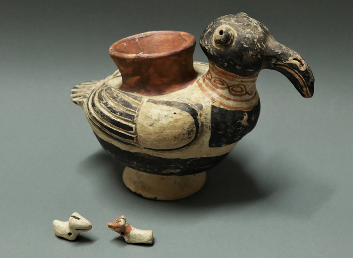 A ceramic effigy vessel in the shape of a condor, which contained two miniature camelid figurines, was unearthed in an offering cache at Pashash. (Mirko Brito)