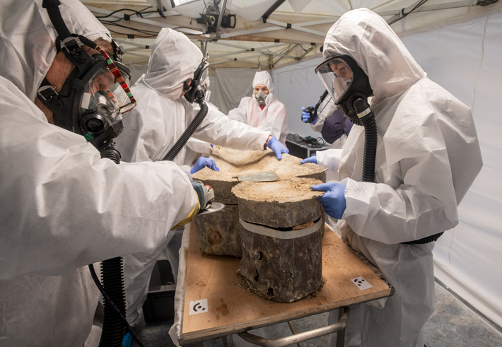 Researchers in a lab in Toulouse, France, studying a lead sarcophagus recovered from beneath the floor of Paris' Notre Dame Cathedral (© Denis Gliksman, Inrap)