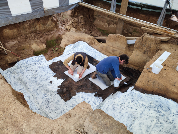 Conservators apply an adhesive layer of silicone rubber to a complete Roman-era cellar in Heddernheim, Germany, before removing it to the local archaeology museum. (W. Muskalla/Archaeological Museum of Frankfurt)