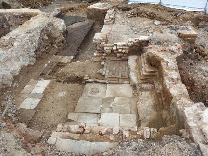 While excavating the remnants of London’s St. Pancras workhouse, archaeologists uncovered flooring made with sandstone from Yorkshire in rooms that they believe served as overseers’ living quarters and offices. (© MOLA)