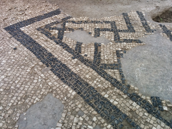 A black-and-white mosaic covers one of the floors of a Roman villa at Pollena Trocchia.